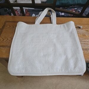 A great CHANEL cream leather expandable tote!